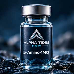 5-Amino-1MQ vial with silver cap and navy Alpha Tides PNW label on a rocky coast
