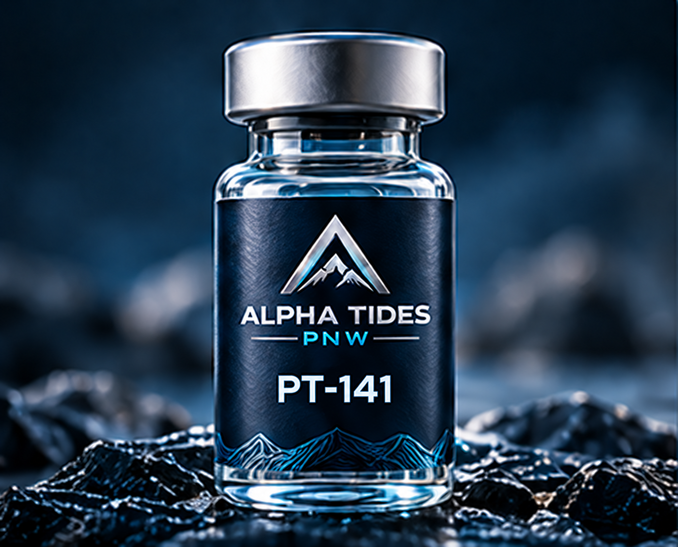 PT-141 vial with silver cap and navy Alpha Tides PNW label on a rocky coast